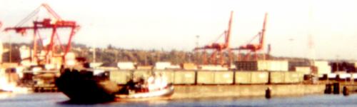 [Photo: blurry barge with boxcars]