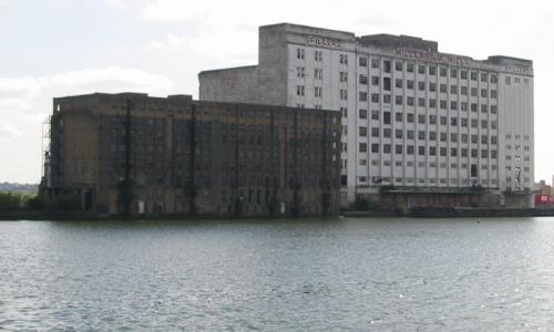 [Photo: dock buildings]