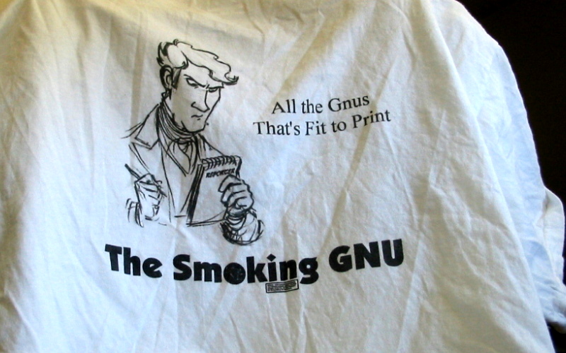 [Photo: shirt back ('All the GNUs that's fit to print')]