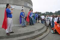 [Photo by Wesley Chan: Justice Unlimited addressing the games]