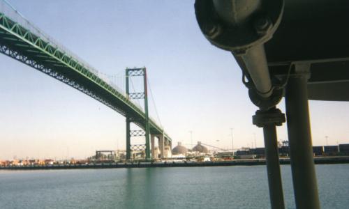 [Photo: view of Terminal Island from San Pedro, featuring a big green bridge]