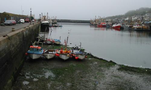 [Photo: rafted boats, high and dry]