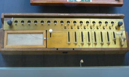 [Photo: old calculating machines]