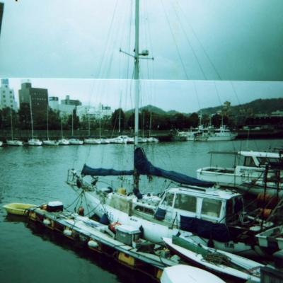 [Photo collage: Tokushima sailboat, piled high]