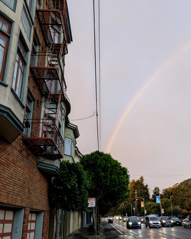 rainbow over a busy street