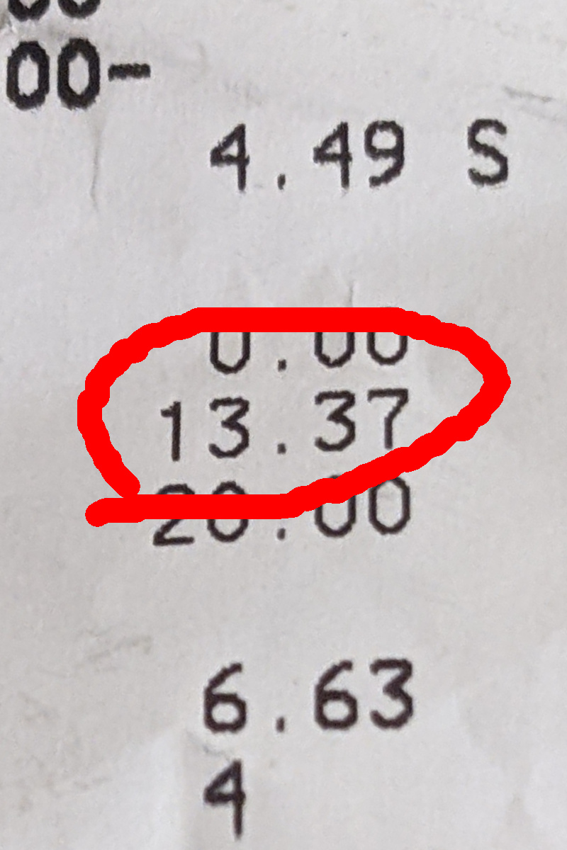 grocery store receipt zoomed in on total $13.37