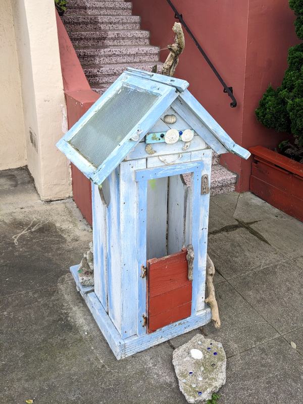 sidewalk decoration in the form of a miniature beach shack