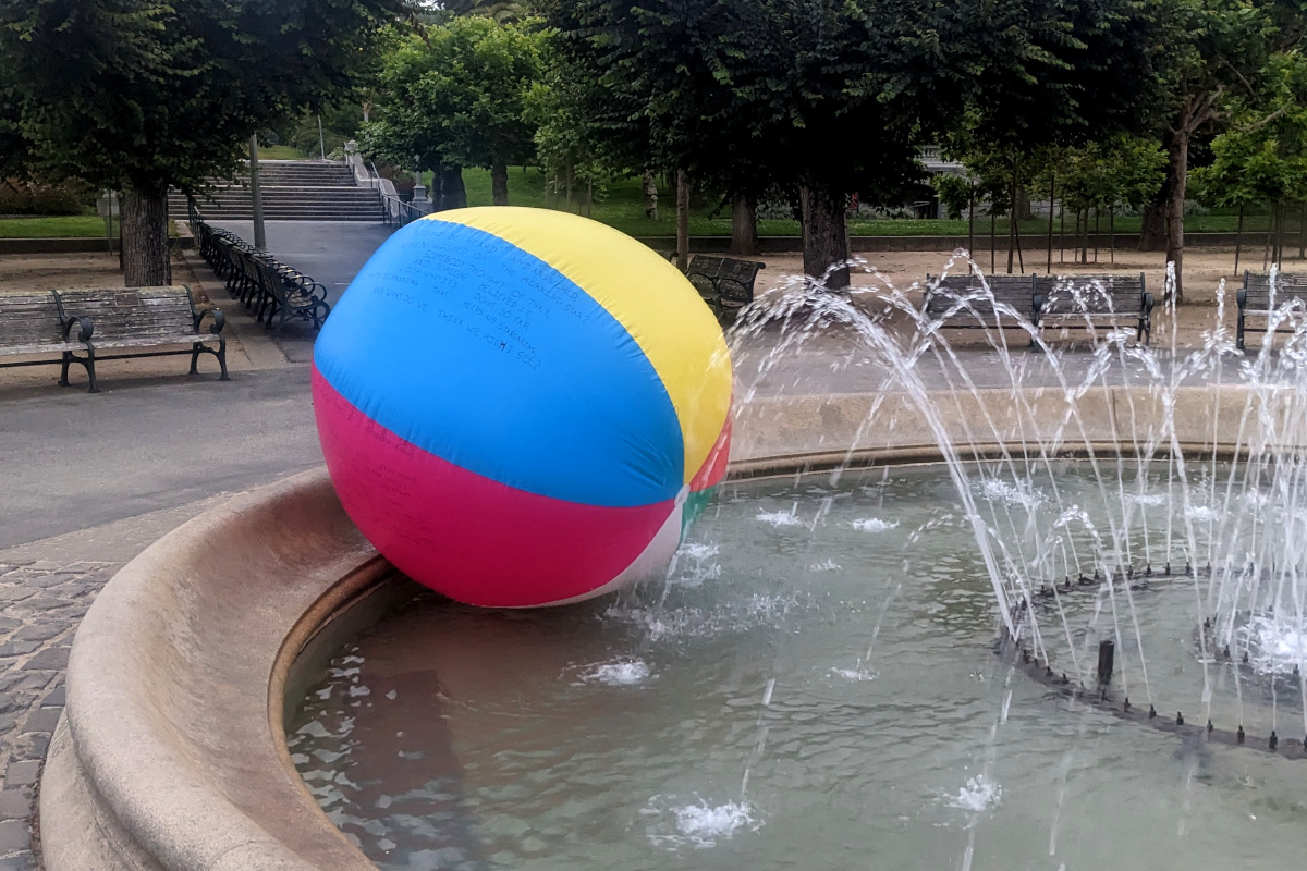 an oversized beach ball in a fountain
