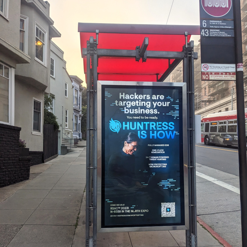 bus shelter ad with copy: Hackers are targeting your business. [something tiny] Huntress is how