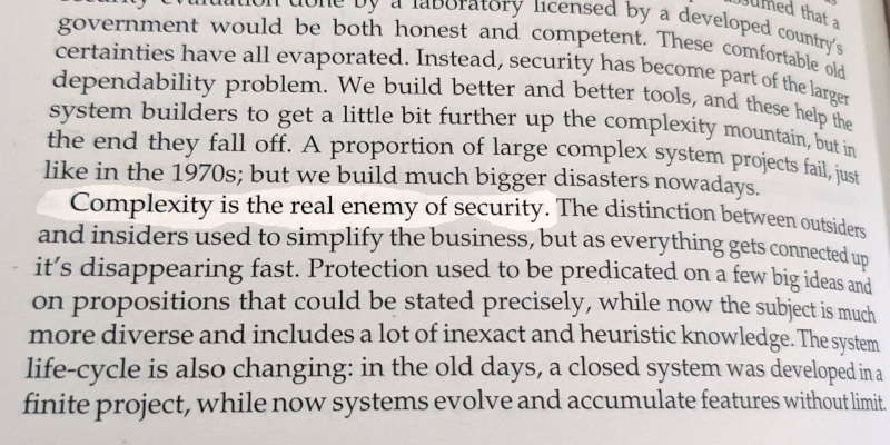 picture of a book, zoomed in on a couple of paragraphs. One sentence is highlighted: "Complexity is the real enemy of security"