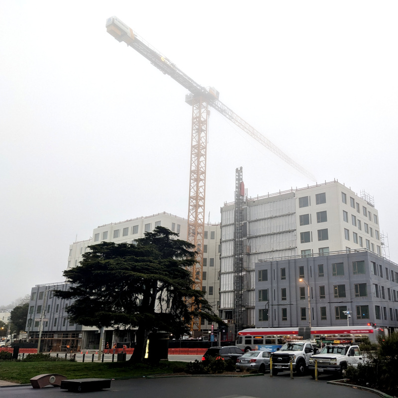 construction site at Stanyan and Waller streets. Above it towers a crane, obscured by fog. If you're wondering why there are weird objects in the foreground, this pic was snapped from the Waller Street Skate Park, which has accumulated some weird objects for skating on