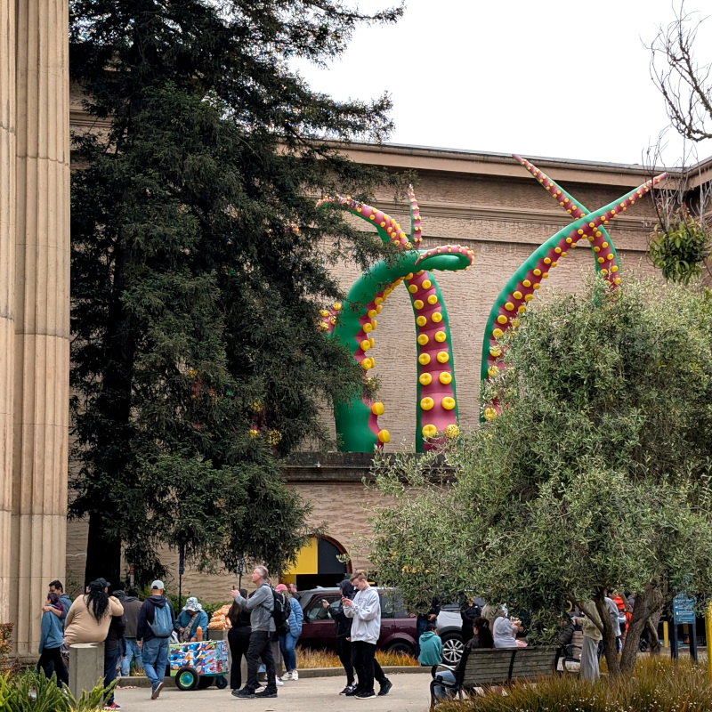northern entrance of SF's Palace of Fine Arts building with some big tentacle balloons on top