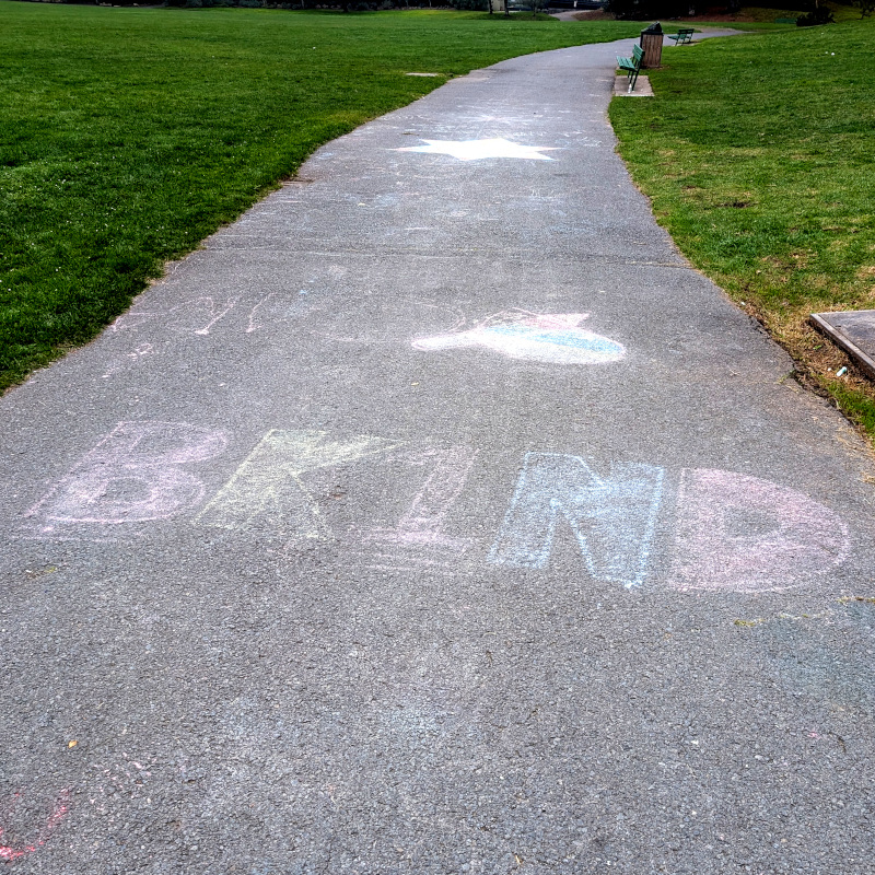 sidewalk chalk art: bk1nd, I guess a stylized "be kind"