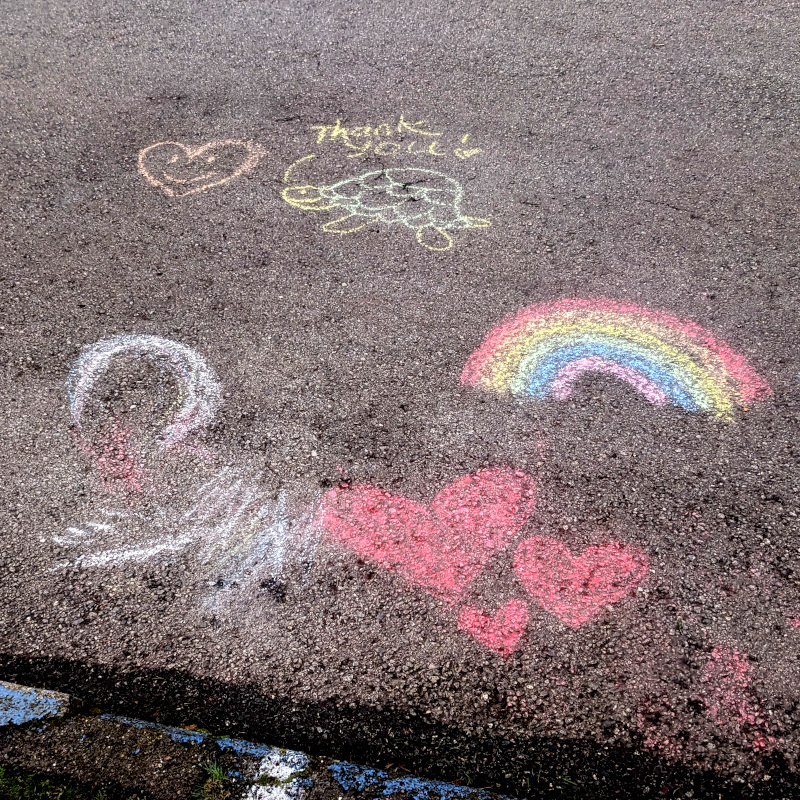 sidewalk chalk art. smiley-face heart. smiling turtle saying 'Thank you!'. Rainbow. Red hearts