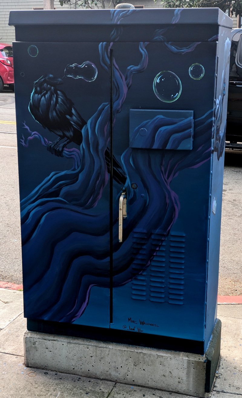 utility box painted with a spooky tree in dark blues and bright purples