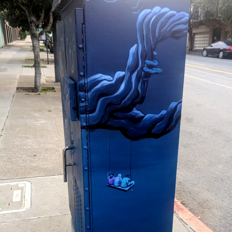 utility box painted with a spooky tree in dark blues and bright purples