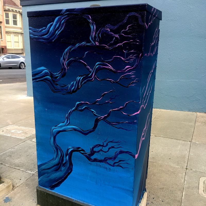 utility box painted with a spooky tree in dark blues and bright purples