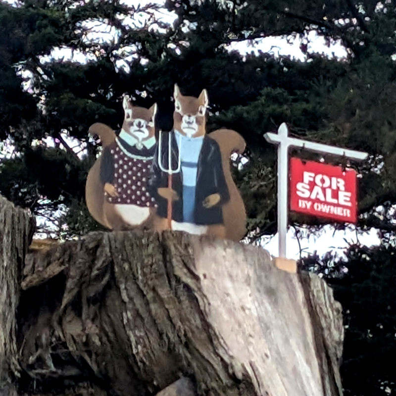 zooming in on the American Gothic squirrel couple. they look kinda blurry; this was probably asking too much of my phone's zoom function, sry