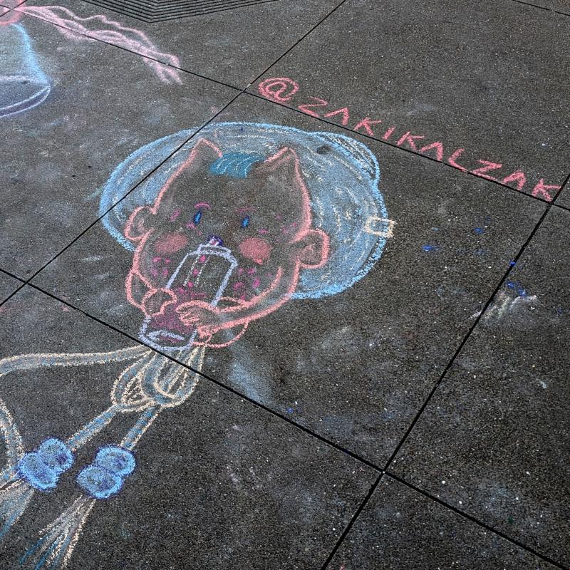 zooming in on the bobbing balloon-like figure, it seems to be a body-less imp with a blue hat sipping from a baby bottle? or something like that?