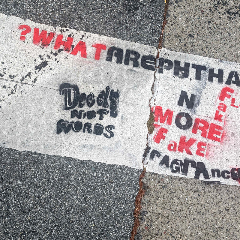 either says 'deeds not words' or 'decals not words' but i am not sure which