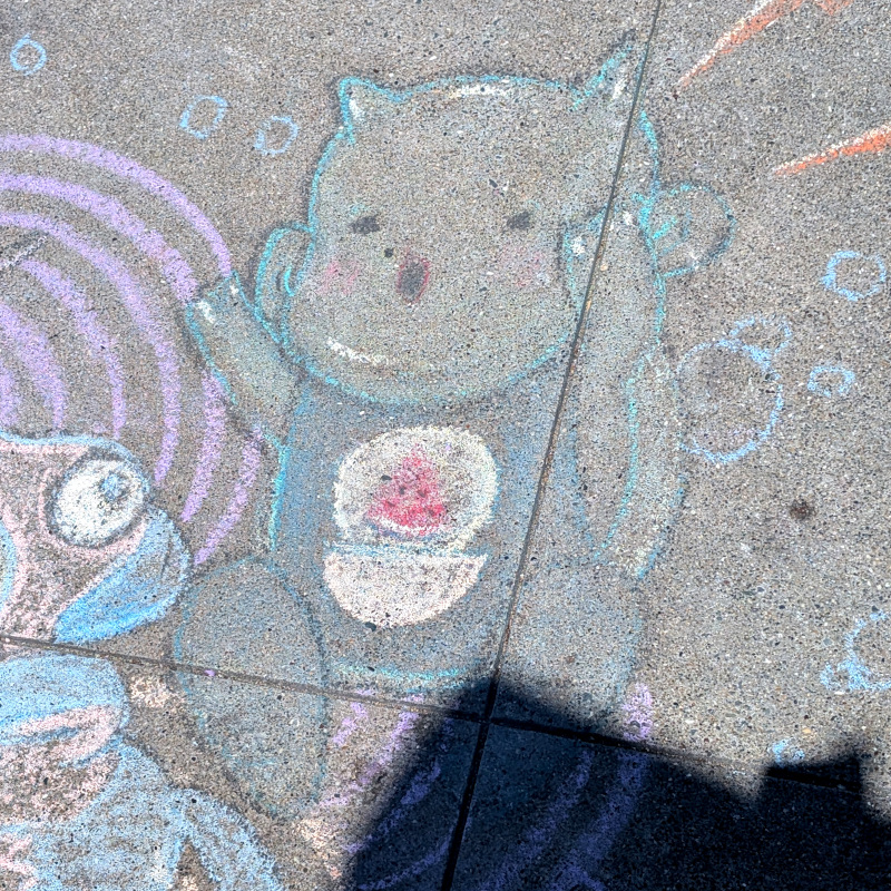 sidewalk chalk art: zooming in on the... imp? cat? hmm