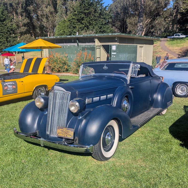 old-timey car. Where you might expect a front license plate, it has an ad for the 1939 World's Fair on Treasure Island (near SF)