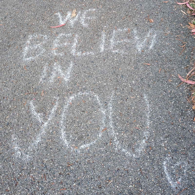 sidewalk writing: We believe in you 🩶