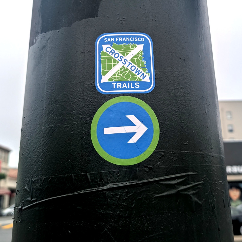 utility pole with a San Francisco Crosstown Trails sticker
