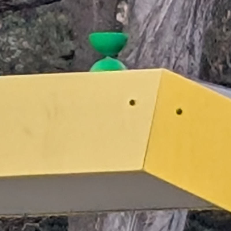 green yo-yo sits atop something yellow
